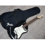 Squier strat by Fender electric guitar with carrycase, needs attention