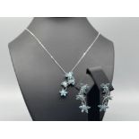 Ladies 9ct white gold blue topaz and diamond butterfly earrings and pendant with chain.