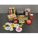 Various storage tins and badges