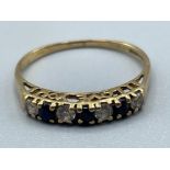 Ladies 9ct gold sapphire and CZ band. 1.24g size L