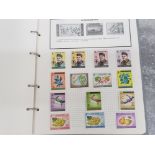 World one stamp album containing miscellaneous stamps from around the world includes UK, Canada,