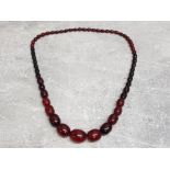 1930s Art deco chunky cherry amber bakelite necklace, length 70cm