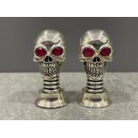A pair of silver plated Skull condiments set with Ruby eyes 61.2g gross