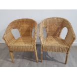 A near pair of wicker chairs.