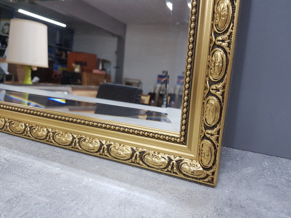 A modern bevelled wall mirror in gold frame 67 x 95cm. - Bild 2 aus 2