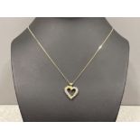 14ct gold diamond set heart pendant and 9ct gold chain measuring in length 44cm 2.8g gross