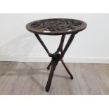 An African heavily carved occasional table with figures 45cm diameter.