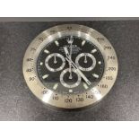 Wall clock in the style of Rolex Daytona silver colour. 34cms