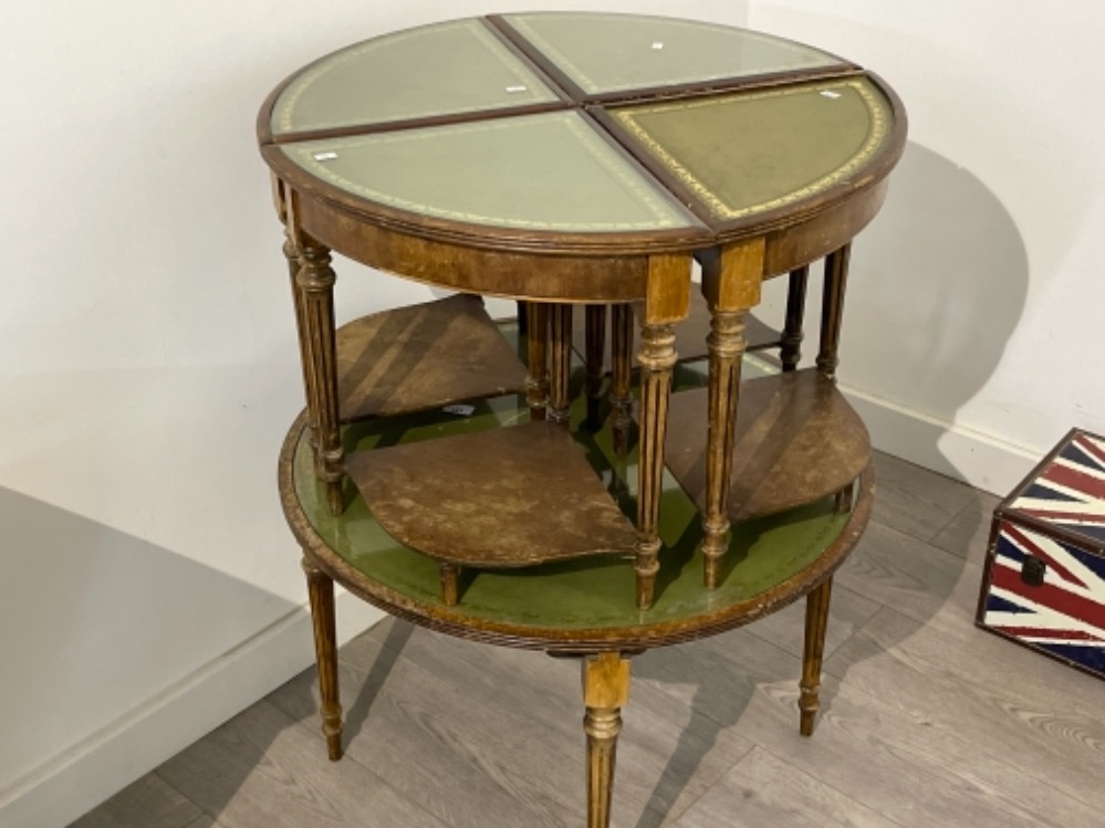 Nest of 5 leather top mahogany tables. (Sas)