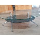 Oval shaped 2 tier glass topped coffee table by Julllian Bowen