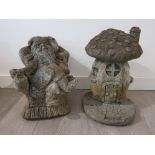 Two composite stone garden ornaments in the form of a gnome and mushroom house, tallest 41cm high.