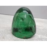 Victorian green glass dump paperweight with 2 internal flowers