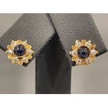 Ladies 9ct gold Blue stone and CZ cluster studs.