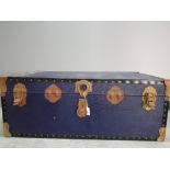 An Overpond travelling trunk with metal mounts 91cm wide.