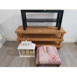 An oak effect tv stand, black side board, a footstool and a wooden and glass candle lantern.