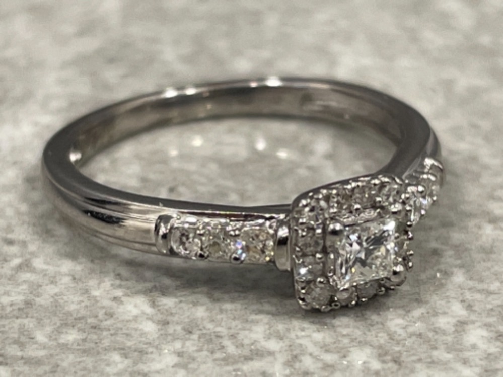 Ladies 9ct white gold diamond ring. Comprising Princess cut and surrounded by a halo of 12 round - Image 2 of 2