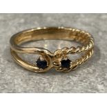 Ladies 9ct gold 2 stone Sapphire ring with a twist design. 2.7g size O