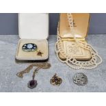 A gold plated edwardian pendant with purple paste stone and seed pearls, a marcasite and paste