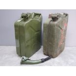 Two green painted metal 20L jerry cans, one with spout.