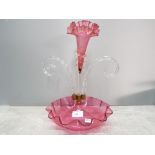 A Victorian cranberry glass epergne with single flute 35cm high.