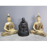 A resin budda and two other deities.