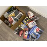 Box of games console leads and controllers including PlayStation, PC and TV accessories