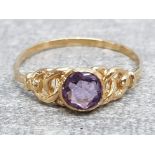 Ladies 9ct yellow gold amethyst ring, featuring a round stone set in the centre with ornate