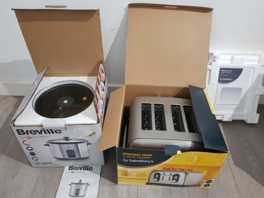 A Breville rice cooker and a sainsbury's 4 slice toaster, both boxed.