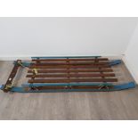 A facsinating and rare WWII sled on original runners painted original blue and crafted for allied