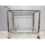 A metal and glass 2 tier drinks trolley.