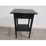 A modern single drawer lamp table 46cm wide.