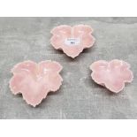 A set of three studio pottery ponk glazed leaf dishes, signed and dated Irene 1990.