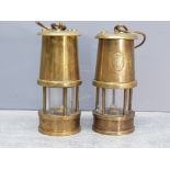 Two miniature brass miners lamps 10cm high.