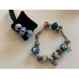 Beaded bracelet and 3 loose silver bead charms