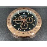 Wall clock in the style of Rolex Daytona gold colour. (34cms)