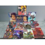 11 Judge Dredd 2000 AD comics plus a boxed Buffy the vampire Slayer boardgame