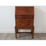 A rare and interesting George III mahogany apprentice/child bureau c1785, the banded front opening