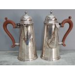 A pair of good quality George I style silver plated coffee or hot chocolate pot and a hot water pot,