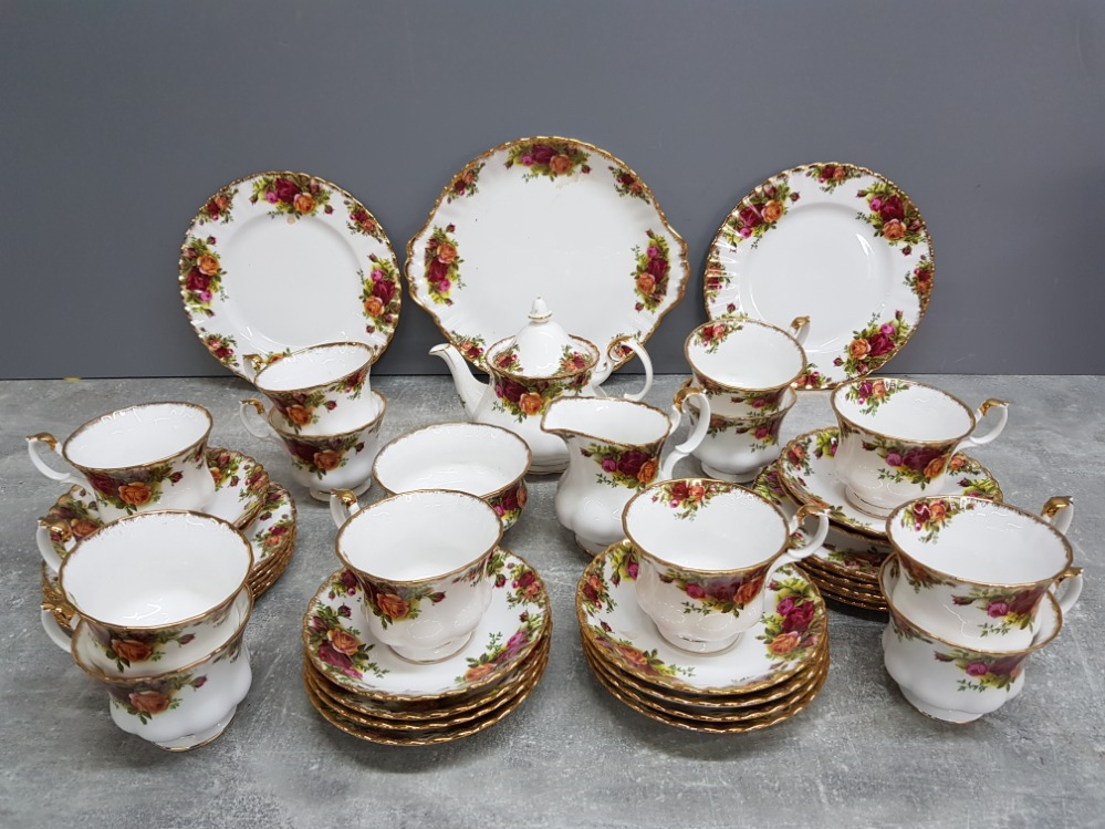 Royal Albert Old Country Roses tea service for 12, one tea plate missing.