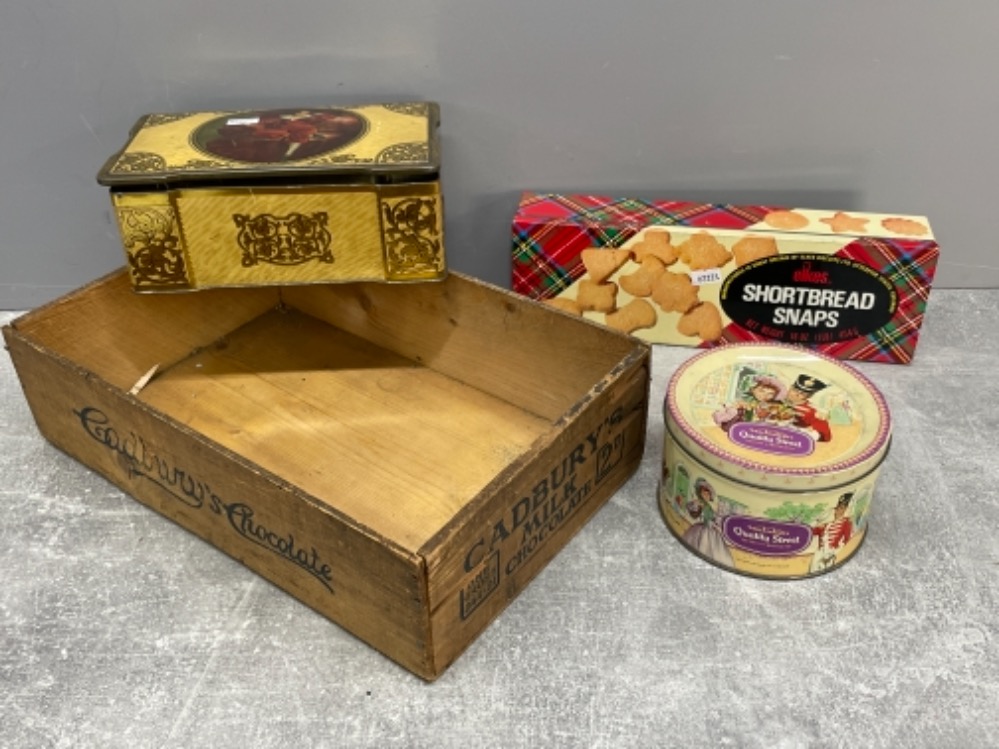 Various vintage tins including Quality street and Cadbury’s milk chocolate wooden crate