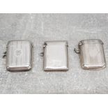 Three silver vesta cases two with engraved decoration 63g.