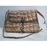 A vintage crocodile skin bag 28cm wide.