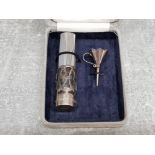 A scent bottle with silver receiver together with a silver funnel in original box, presented by