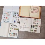 4 albums of miscellaneous stamps from around the world