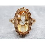 Ladies 9ct yellow gold citrine ring, featuring a oval stone set in a fancy edge, 3.7g size P