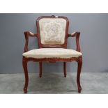 A Louis XIV style open armchair.