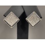 Pair of 14ct white gold pave set Sapphire and Diamond earrings