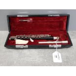 A Yamaha YPC 32 piccolo with resin body and silvered metal mounts, no 26978, in fitted case.