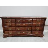 A reproduction serpentine fronted chest of 12 drawers 173 x 87 x 47cm.