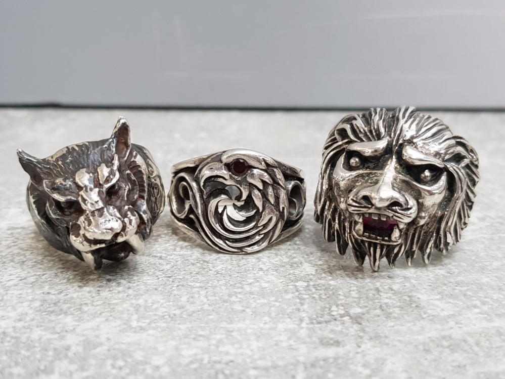 3 silver gents rings includes Eagle, lion with red stone and Smilodon (saber toothed tiger) 69.2g,